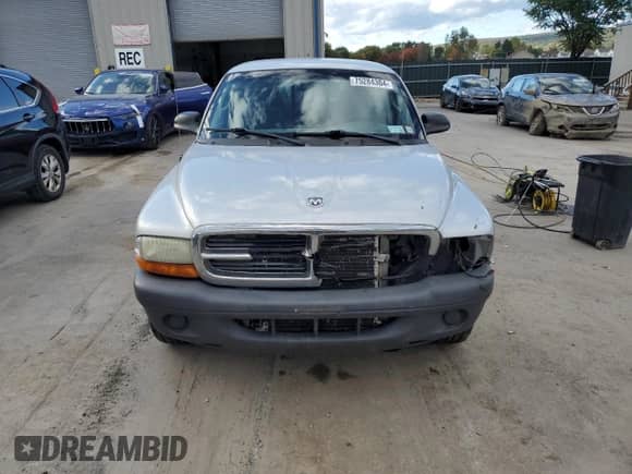 2004 Dodge Dakota z VIN 1D7FL16K24S621269, wystawiony jako Copart lot #75284304 z przebiegiem Nie podano mil oraz Szkoda całkowita • Salvage title. Historia ofert i sprzedaży dostępna na DreamBid. Obrazek 5.