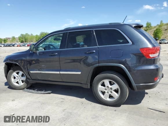 ✅ 2013 Jeep Grand Cherokee Laredo • VIN: 1C4RJFAG7DC645932 • Lot: 57969715. Listed on Copart with 165,717 mi. Free auction sales archive from the USA and detailed vehicle history report at DreamBid. Image 2.