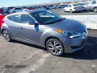 2016 Hyundai Veloster z VIN KMHTC6AD3GU276972, wystawiony jako IAAI lot #43544262 z przebiegiem 93 089 mil mil oraz . Historia ofert i sprzedaży dostępna na DreamBid. Obrazek 1.