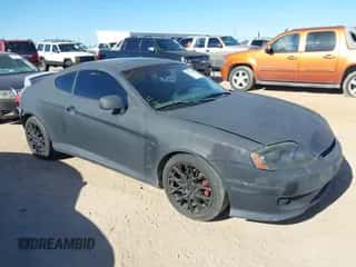 2005 Hyundai Tiburon GS z VIN KMHHM65D65U157713, wystawiony jako IAAI lot #42039826 z przebiegiem 184 368 mil mil oraz . Historia ofert i sprzedaży dostępna na DreamBid. Obrazek 1.