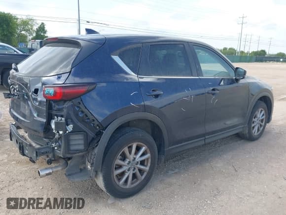 ✅ 2023 Mazda CX-5 S Carbon Edition • VIN: JM3KFBCM6P0165036 • Lot: 42622732. Listed on IAAI with 44,497 mi. Free auction sales archive from the USA and detailed vehicle history report at DreamBid. Image 4.