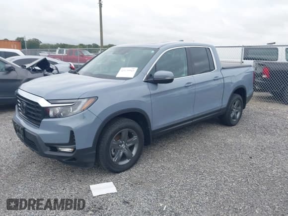 ✅ 2023 Honda Ridgeline RTL • VIN: 5FPYK3F5XPB067693 • Lot: 43179943. Listed on IAAI with 29,097 mi. Free auction sales archive from the USA and detailed vehicle history report at DreamBid. Image 2.