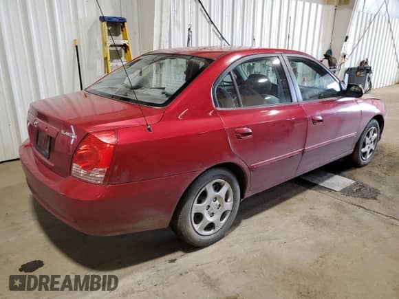 2004 Hyundai Elantra GLS with VIN KMHDN46D14U711429, listed as a Copart auction lot 85075885 with 92,027 mi miles and Salvage title. Bid and sale history available at DreamBid. Image 3.