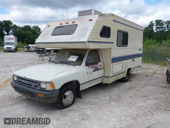 ✅ 1990 Toyota Pickup • VIN: JT5VN94T9L0012762 • Lot: 42989379. Listed on IAAI with 93,466 mi. Free auction sales archive from the USA and detailed vehicle history report at DreamBid. Image 2.