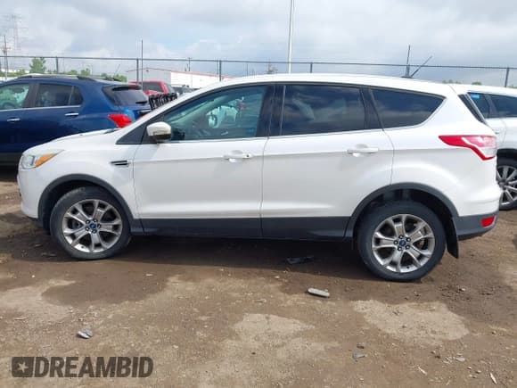 ✅ 2013 Ford Escape SEL • VIN: 1FMCU9HX6DUB14053 • Lot: 42361297. Wystawiony na IAAI z przebiegiem 144 861 mil. Bezpłatny archiwum sprzedaży aukcyjnych z USA i szczegółowy raport historii pojazdu na DreamBid. Zdjęcie 14.