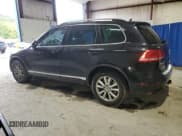 ✅ 2014 Volkswagen Touareg Sport • VIN: WVGEF9BP0ED008887 • Lot: 71643635. Listed on Copart with 233,433 mi. Free auction sales archive from the USA and detailed vehicle history report at DreamBid. Image 2.