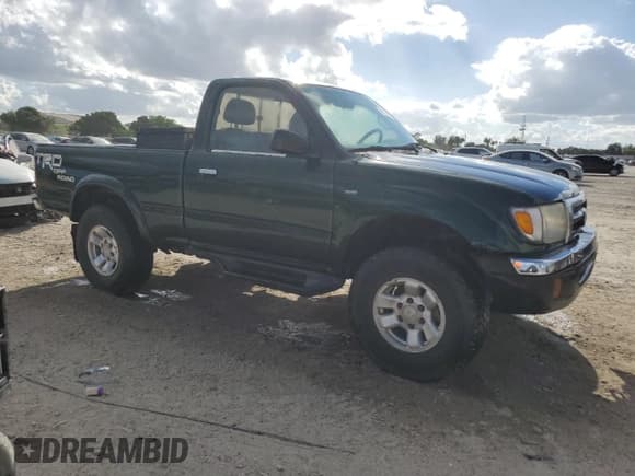 ✅ 1999 Toyota Tacoma PreRunner • VIN: 4TANM92N0XZ458484 • Lot: 86821585. Listed on Copart with Not provided. Free auction sales archive from the USA and detailed vehicle history report at DreamBid. Image 4.