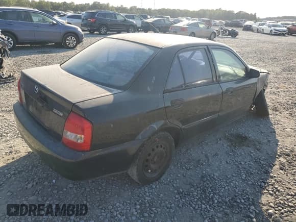 ✅ 1999 Mazda Protege DX • VIN: JM1BJ2221X0172757 • Lot: 75818584. Wystawiony na Copart z przebiegiem 278 032 mil. Bezpłatny archiwum sprzedaży aukcyjnych z USA i szczegółowy raport historii pojazdu na DreamBid. Zdjęcie 3.