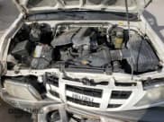 ✅ 2004 Isuzu Rodeo S • VIN: 4S2CK58Y244309017 • Lot: 83303294. Listed on Copart with 121,723 mi. Free auction sales archive from the USA and detailed vehicle history report at DreamBid. Image 12.