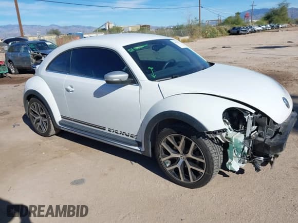 ✅ 2016 Volkswagen Beetle Dune • VIN: 3VWS17AT8GM632868 • Lot: 43810321. Listed on IAAI with 75,311 mi. Free auction sales archive from the USA and detailed vehicle history report at DreamBid. Image 1.