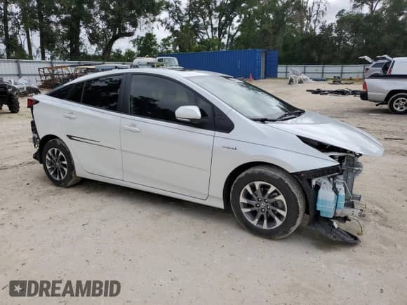 2021 Toyota Prius L Eco with VIN JTDKAMFU4M3139334, listed as a Copart auction lot 84025305 with 59,418 mi miles and Salvage title. Bid and sale history available at DreamBid. Image 4.