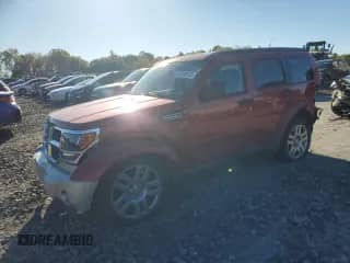 2011 Dodge Nitro Heat z VIN 1D4PU4GK6BW529117, wystawiony jako Copart lot #82305125 z przebiegiem 180 005 mil mil oraz Szkoda całkowita • Salvage title. Historia ofert i sprzedaży dostępna na DreamBid. Obrazek 1.