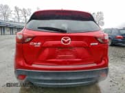 ✅ 2016 Mazda CX-5 Grand Touring • VIN: JM3KE4DY4G0703846 • Lot: 93990465. Listed on Copart with 86,638 mi. Free auction sales archive from the USA and detailed vehicle history report at DreamBid. Image 6.