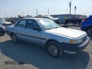 ✅ 1990 Toyota Camry DLX • VIN: 4T1SV21E8LU130567 • Лот: 43083587. Опубликован ранее на IAAI с пробегом 141 836 миль. Бесплатный доступ к архиву аукционных продаж из США и подробный отчёт об истории автомобиля на DreamBid. Изображение 1.