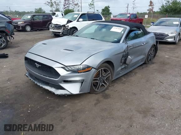 2021 Ford Mustang EcoBoost z VIN 1FATP8UH3M5104956, wystawiony jako IAAI lot #43363896 z przebiegiem 122 055 mil mil oraz . Historia ofert i sprzedaży dostępna na DreamBid. Obrazek 2.