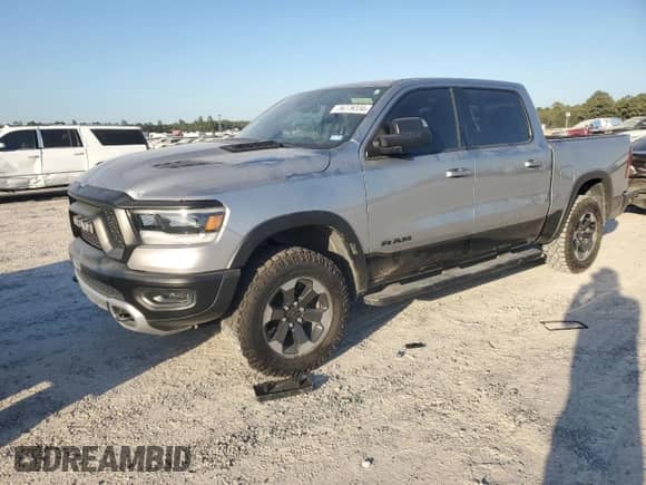 2020 Ram 1500 Rebel с VIN 1C6RRELT7LN299176, выставлен на аукционе Copart как лот 76778334 с пробегом 70 059 миль миль и Списание • Salvage title. История ставок и продаж доступна на DreamBid. Изображение 1.