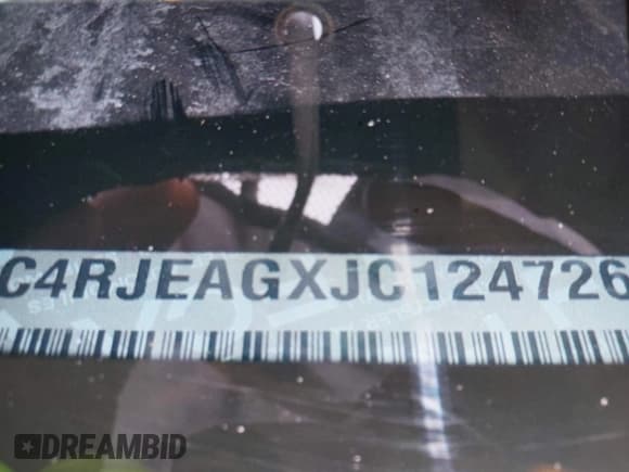 ✅ 2018 Jeep Grand Cherokee Laredo E • VIN: 1C4RJEAGXJC124726 • Lot: 41990741. Listed on IAAI with 112,217 mi. Free auction sales archive from the USA and detailed vehicle history report at DreamBid. Image 9.