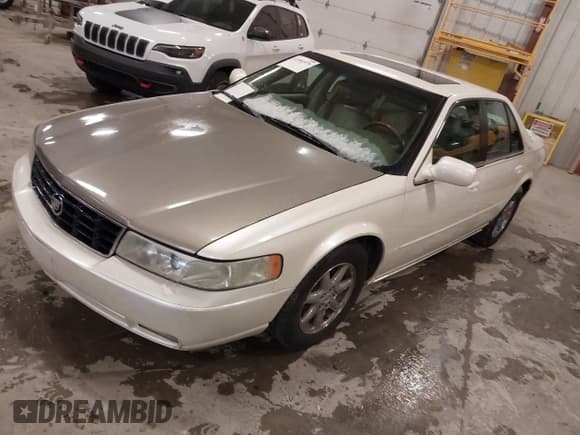 ✅ 2002 Cadillac Seville Touring STS • VIN: 1G6KY54942U137349 • Lot: 41991979. Wystawiony na IAAI z przebiegiem 143 169 mil. Bezpłatny archiwum sprzedaży aukcyjnych z USA i szczegółowy raport historii pojazdu na DreamBid. Zdjęcie 2.