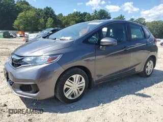 ✅ 2018 Honda Fit LX • VIN: 3HGGK5G49JM719939 • Лот: 70601025. Опубликован ранее на Copart с пробегом 100 231 миль. Бесплатный доступ к архиву аукционных продаж из США и подробный отчёт об истории автомобиля на DreamBid. Изображение 1.