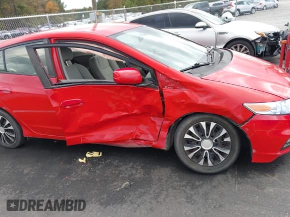 ✅ 2013 Honda Insight • VIN: JHMZE2H30DS003797 • Lot: 43580287. Listed on IAAI with 104,858 mi. Free auction sales archive from the USA and detailed vehicle history report at DreamBid. Image 6.