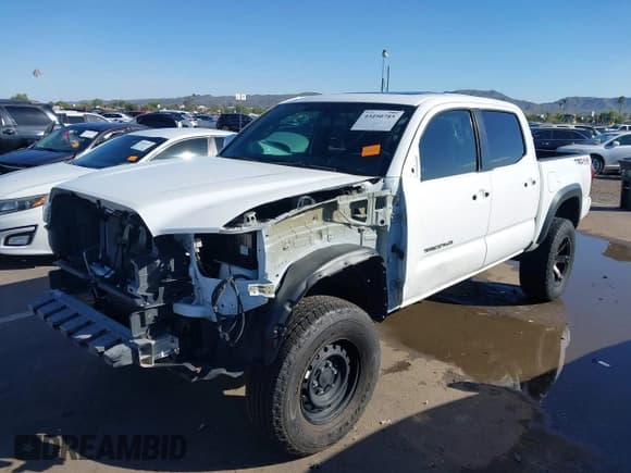 ✅ 2017 Toyota Tacoma SR5 • VIN: 3TMCZ5AN0HM103406 • Lot: 43450785. Listed on IAAI with 96,527 mi. Free auction sales archive from the USA and detailed vehicle history report at DreamBid. Image 18.