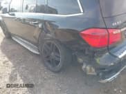 ✅ 2015 Mercedes-Benz GL 63 AMG • VIN: 4JGDF7EE4FA457521 • Лот: 42001812. Опубликован ранее на IAAI с пробегом 99 041 миль. Бесплатный доступ к архиву аукционных продаж из США и подробный отчёт об истории автомобиля на DreamBid. Изображение 6.