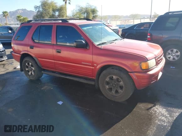 ✅ 1999 Isuzu Rodeo S • VIN: 4S2CK58W3X4307201 • Lot: 41884901. Listed on IAAI with 236,970 mi. Free auction sales archive from the USA and detailed vehicle history report at DreamBid. Image 1.