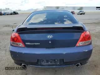2006 Hyundai Tiburon GS с VIN KMHHM65D26U218704, выставлен на аукционе Copart как лот 80553255 с пробегом 211 718 миль миль и Списание • Salvage title. История ставок и продаж доступна на DreamBid. Изображение 6.