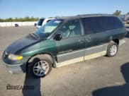 ✅ 2000 Dodge Caravan LE • VIN: 1B4GP54L7YB571056 • Lot: 71631365. Listed on Copart with 136,970 mi. Free auction sales archive from the USA and detailed vehicle history report at DreamBid. Image 1.