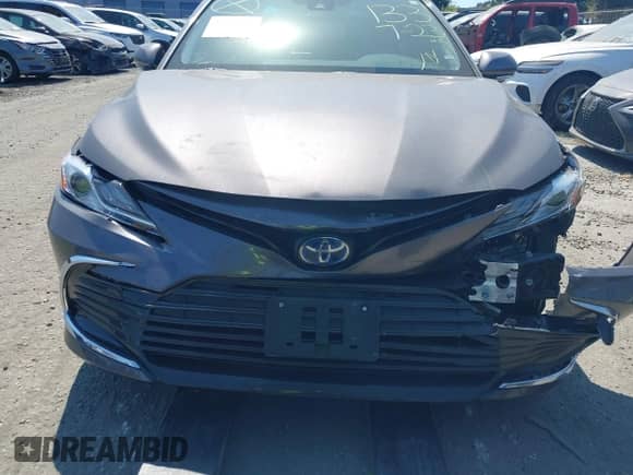 2022 Toyota Camry Hybrid XLE with VIN 4T1F31AK4NU571560, listed as a IAAI auction lot 42654973 with 10,810 mi miles and . Bid and sale history available at DreamBid. Image 12.