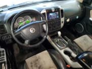 ✅ 2007 Mercury Mariner Premier • VIN: 4M2CU97147KJ02737 • Lot: 91291695. Wystawiony na Copart z przebiegiem 187 727 mil. Bezpłatny archiwum sprzedaży aukcyjnych z USA i szczegółowy raport historii pojazdu na DreamBid. Zdjęcie 8.