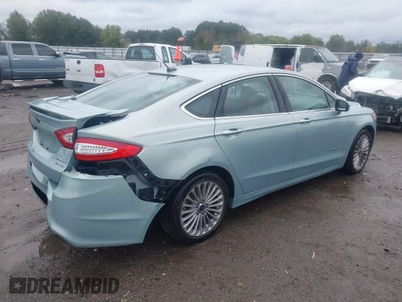 ✅ 2014 Ford Fusion Titanium Hybrid • VIN: 3FA6P0RU8ER350016 • Lot: 43532622. Listed on IAAI with 87,458 mi. Free auction sales archive from the USA and detailed vehicle history report at DreamBid. Image 4.