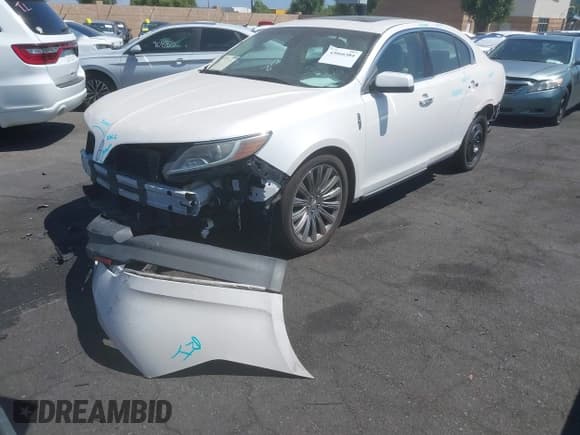 ✅ 2015 Lincoln MKS • VIN: 1LNHL9DK0FG608347 • Lot: 43066384. Listed on IAAI with 47,333 mi. Free auction sales archive from the USA and detailed vehicle history report at DreamBid. Image 2.
