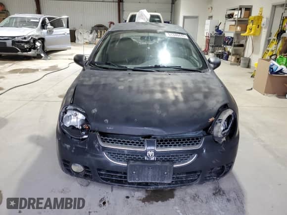 2004 Dodge Neon SXT z VIN 1B3ES56CX4D596703, wystawiony jako Copart lot #51340445 z przebiegiem 184 207 mil mil oraz Szkoda całkowita • Salvage title. Historia ofert i sprzedaży dostępna na DreamBid. Obrazek 5.