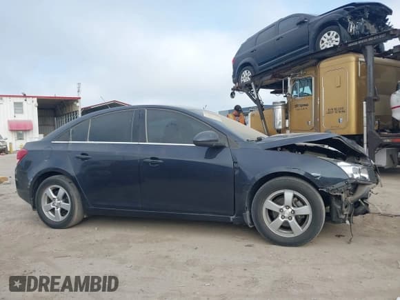 ✅ 2015 Chevrolet Cruze LT • VIN: 1G1PC5SB8F7259166 • Lot: 43535489. Listed on IAAI with 70,739 mi. Free auction sales archive from the USA and detailed vehicle history report at DreamBid. Image 14.