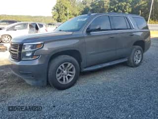 2015 Chevrolet Tahoe LS with VIN 1GNSCAKCXFR623862, listed as a Copart auction lot 70932985 with 140,786 mi miles and Salvage title. Bid and sale history available at DreamBid. Image 1.