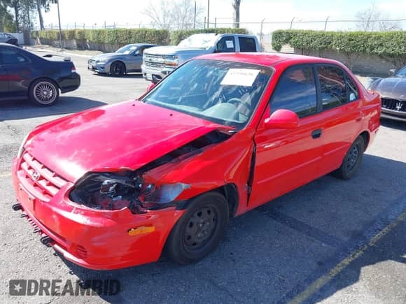 2003 Hyundai Accent GL z VIN KMHCG45C93U487209, wystawiony jako IAAI lot #41590636 z przebiegiem 118 811 mil mil oraz . Historia ofert i sprzedaży dostępna na DreamBid. Obrazek 17.