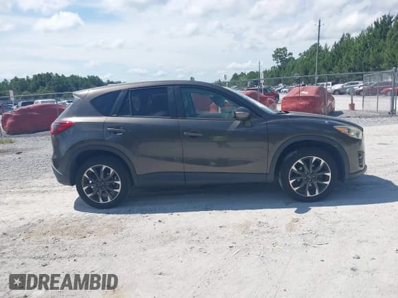 ✅ 2016 Mazda CX-5 Grand Touring • VIN: JM3KE2DY7G0782899 • Lot: 42949510. Wystawiony na IAAI z przebiegiem 85 502 mil. Bezpłatny archiwum sprzedaży aukcyjnych z USA i szczegółowy raport historii pojazdu na DreamBid. Zdjęcie 13.