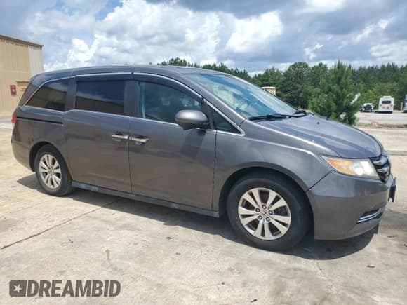 ✅ 2014 Honda Odyssey EX-L • VIN: 5FNRL5H65EB040989 • Lot: 60655755. Listed on Copart with 224,963 mi. Free auction sales archive from the USA and detailed vehicle history report at DreamBid. Image 4.