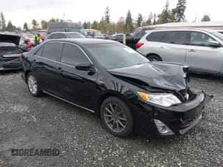 ✅ 2014 Toyota Camry XLE • VIN: 4T1BD1FK1EU110398 • Lot: 43514387. Listed on IAAI with 197,486 mi. Free auction sales archive from the USA and detailed vehicle history report at DreamBid. Image 1.