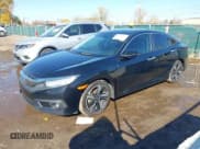 ✅ 2017 Honda Civic Touring • VIN: 19XFC1F99HE025978 • Lot: 43544695. Listed on IAAI with 123,323 mi. Free auction sales archive from the USA and detailed vehicle history report at DreamBid. Image 2.