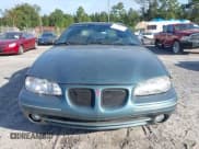 ✅ 1996 Pontiac Grand Am SE • VIN: 1G2NE52M7TC721718 • Lot: 43268073. Wystawiony na IAAI z przebiegiem 115 223 mil. Bezpłatny archiwum sprzedaży aukcyjnych z USA i szczegółowy raport historii pojazdu na DreamBid. Zdjęcie 6.