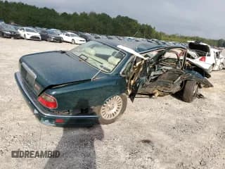 ✅ 1996 Jaguar XJ Vanden Plas • VIN: SAJKX6245TC782985 • Лот: 73538834. Опубликован ранее на Copart с пробегом Не указан. Бесплатный доступ к архиву аукционных продаж из США и подробный отчёт об истории автомобиля на DreamBid. Изображение 3.