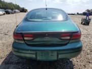 ✅ 1999 Ford Taurus SE • VIN: 1FAFP53U0XG112855 • Lot: 80790835. Wystawiony na Copart z przebiegiem 163 262 mil. Bezpłatny archiwum sprzedaży aukcyjnych z USA i szczegółowy raport historii pojazdu na DreamBid. Zdjęcie 6.