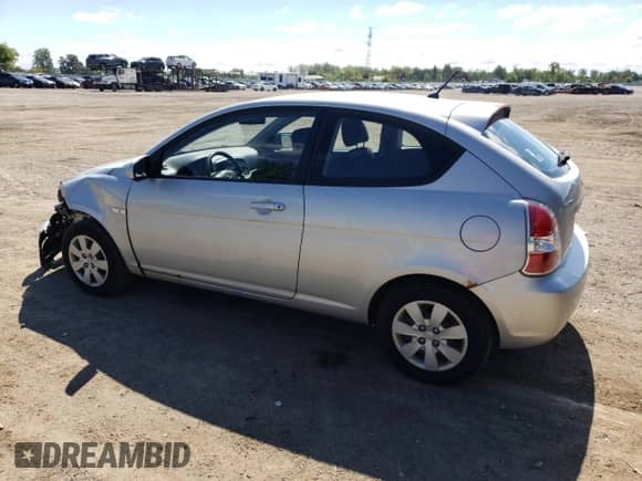 2010 Hyundai Accent L with VIN KMHCN3BCXAU182917, listed as a Copart auction lot 69464685 with 124,678 mi miles and Salvage title. Bid and sale history available at DreamBid. Image 2.