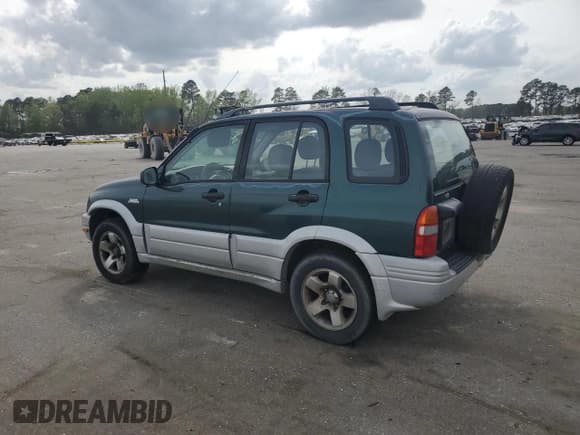 ✅ 1999 Suzuki Grand Vitara JLX • VIN: JS3TD62V0X4124366 • Лот: 50885055. Опубликован ранее на Copart с пробегом 204 168 миль. Бесплатный доступ к архиву аукционных продаж из США и подробный отчёт об истории автомобиля на DreamBid. Изображение 2.