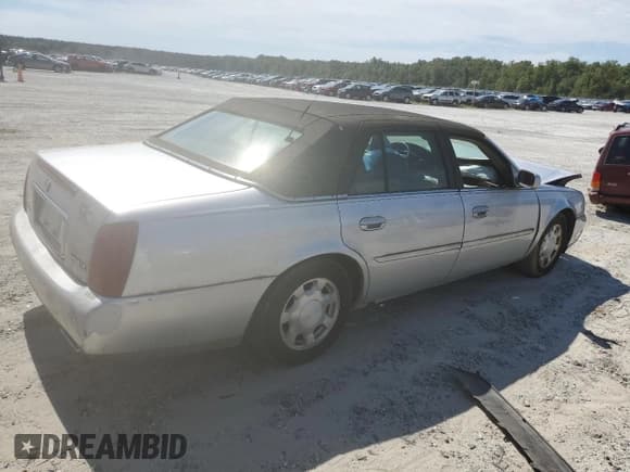 ✅ 2001 Cadillac DeVille • VIN: 1G6KD54Y61U241472 • Lot: 69449404. Listed on Copart with 104,543 mi. Free auction sales archive from the USA and detailed vehicle history report at DreamBid. Image 3.
