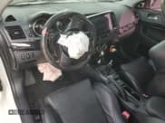 ✅ 2014 Mitsubishi Lancer Evolution GSR • VIN: JA32W8FV2EU019253 • Lot: 86615084. Wystawiony na Copart z przebiegiem 104 894 mil. Bezpłatny archiwum sprzedaży aukcyjnych z USA i szczegółowy raport historii pojazdu na DreamBid. Zdjęcie 8.