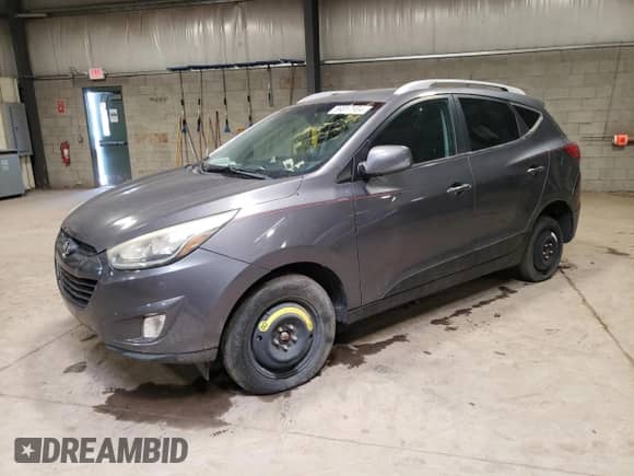 2015 Hyundai Tucson SE z VIN KM8JU3AG1FU973407, wystawiony jako Copart lot #59017604 z przebiegiem Nie podano mil oraz Szkoda całkowita • Salvage title. Historia ofert i sprzedaży dostępna na DreamBid. Obrazek 1.