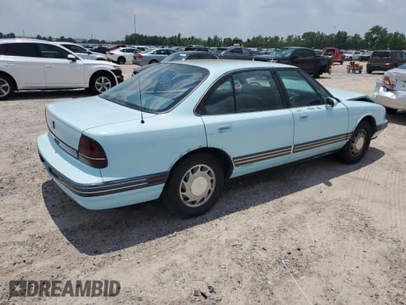 ✅ 1992 Oldsmobile 88 • VIN: 1G3HN53L4NH348979 • Lot: 59209184. Wystawiony na Copart z przebiegiem 144 820 mil. Bezpłatny archiwum sprzedaży aukcyjnych z USA i szczegółowy raport historii pojazdu na DreamBid. Zdjęcie 3.